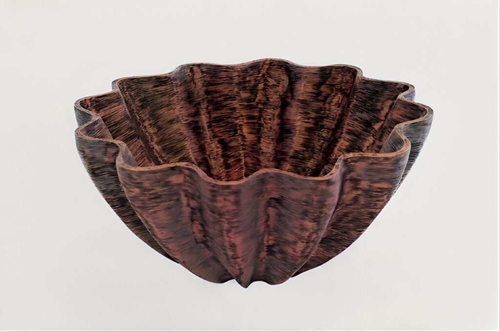 Wave Essence, a fluted, scalloped turned bowl with a dark burned wave texture